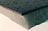 Foam absorption with a barrier layer 